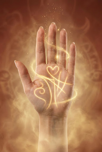 A mystical glowing hand with golden destiny lines